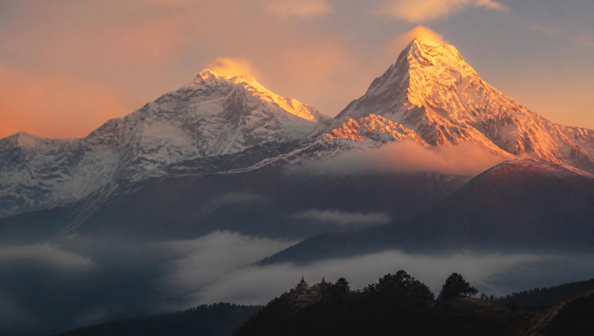 Himalayan peaks at dawn with golden light on the summits